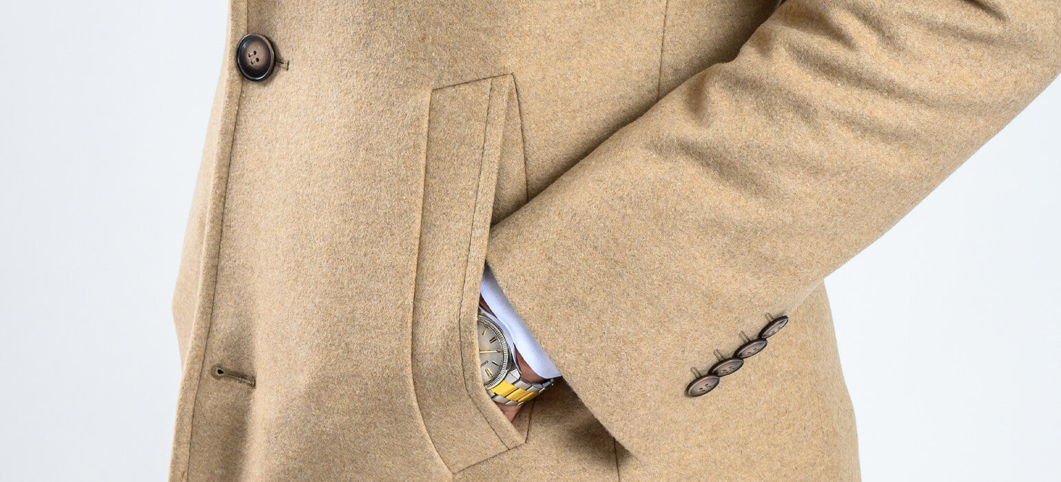 Béžový vlnený kabát so šikmými vreckami